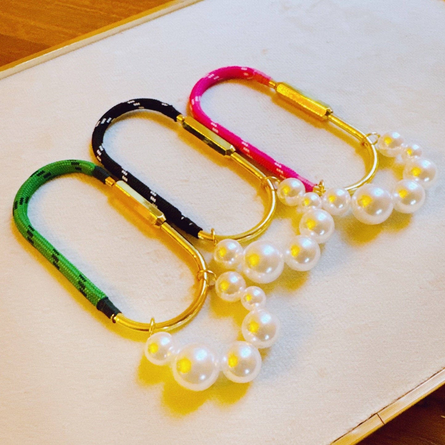 roped and pearled shackle bag charm