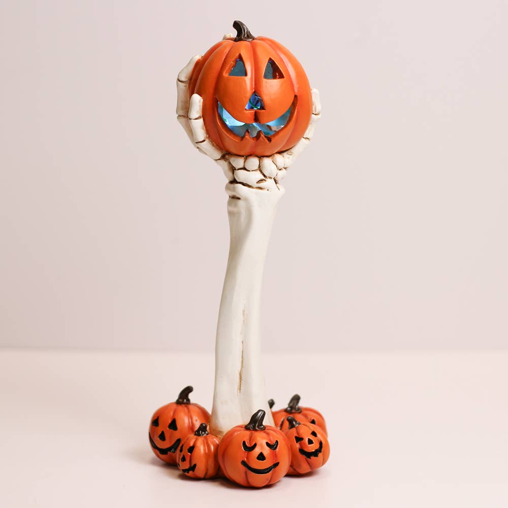 pumpkin skull hand