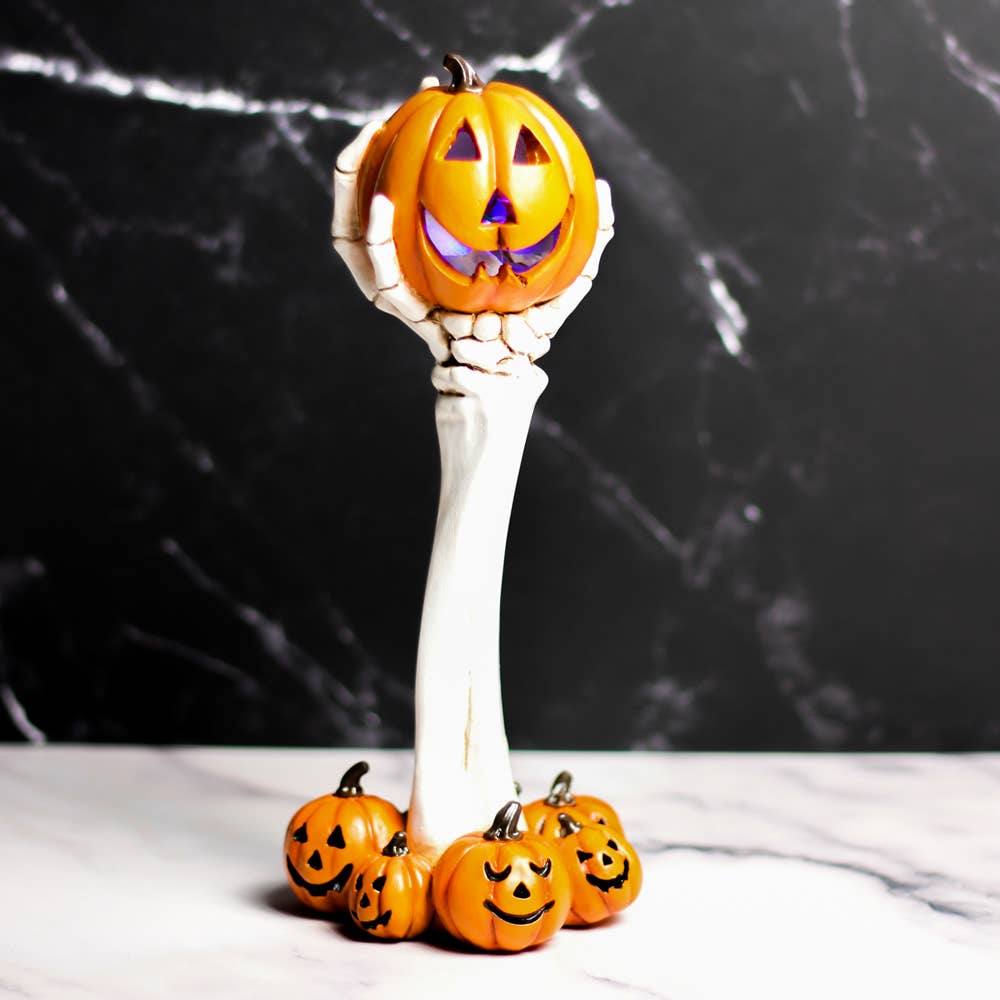 pumpkin skull hand